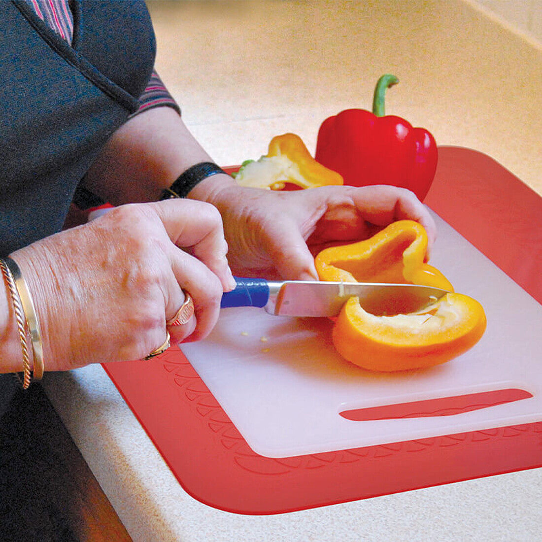 Tenura yellow silicone anti-slip table mat under a plate